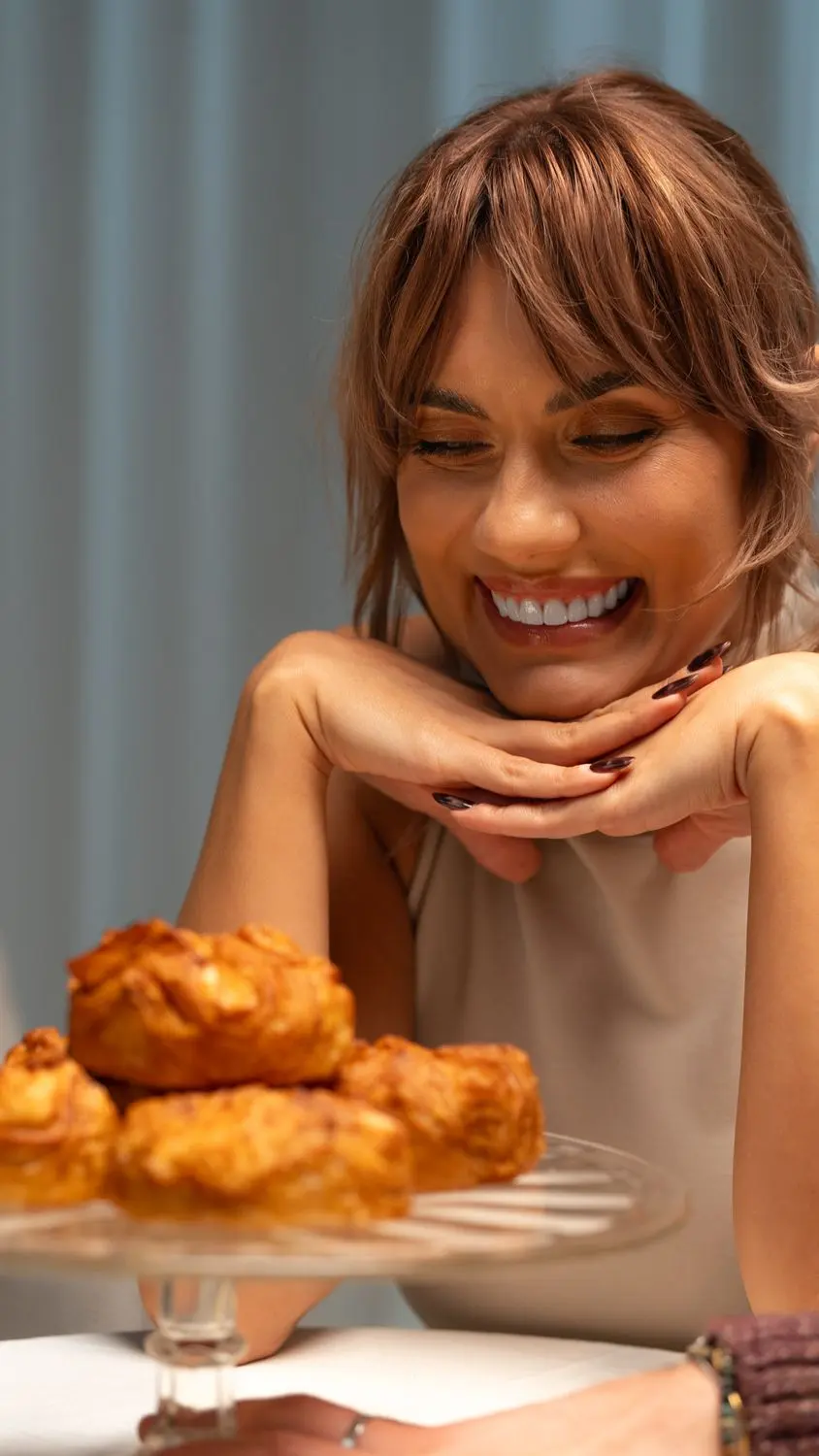 Smiling over a plate of anemones