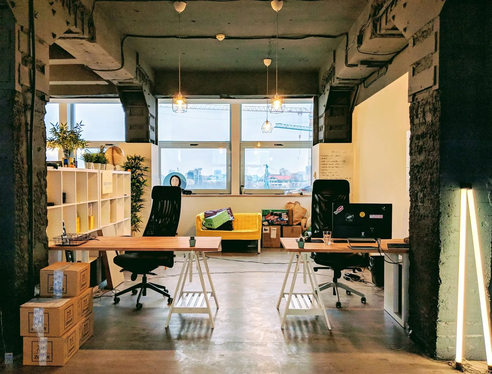 The open studio floor in Eliade Tower, desks by the long windows