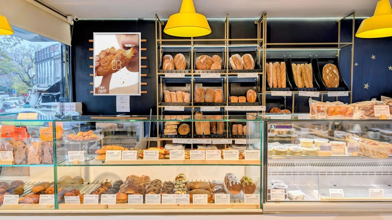 Inside the bakery, the anemone poster above the counter