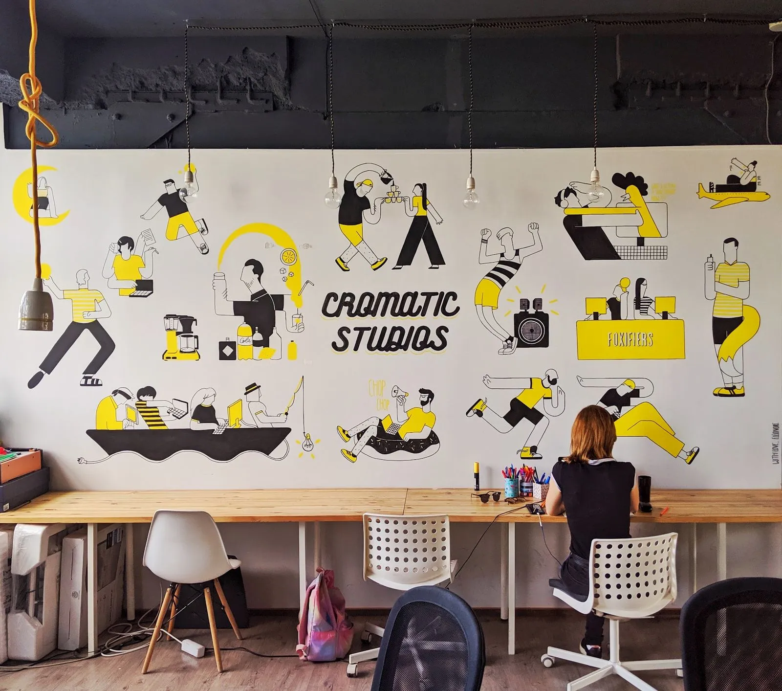 The mural wall with the Cromatic Studios characters