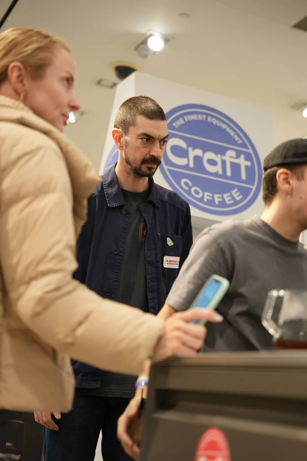 The team with visitors, under the Craft Coffee badge