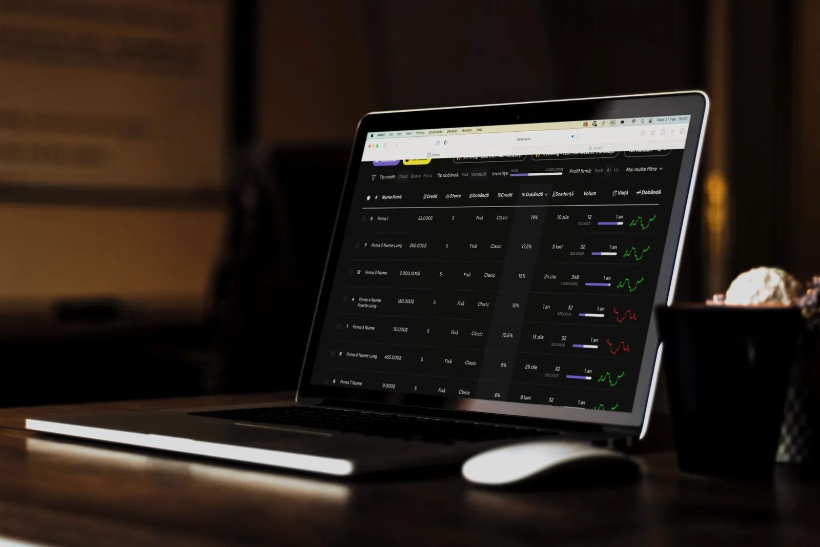 A laptop on a dark desk showing the Venevo marketplace table
