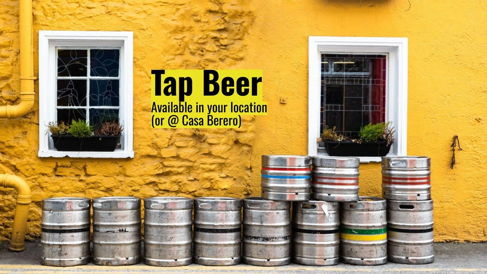 Tap beer, available in your location or at Casa Berero, kegs against a yellow wall
