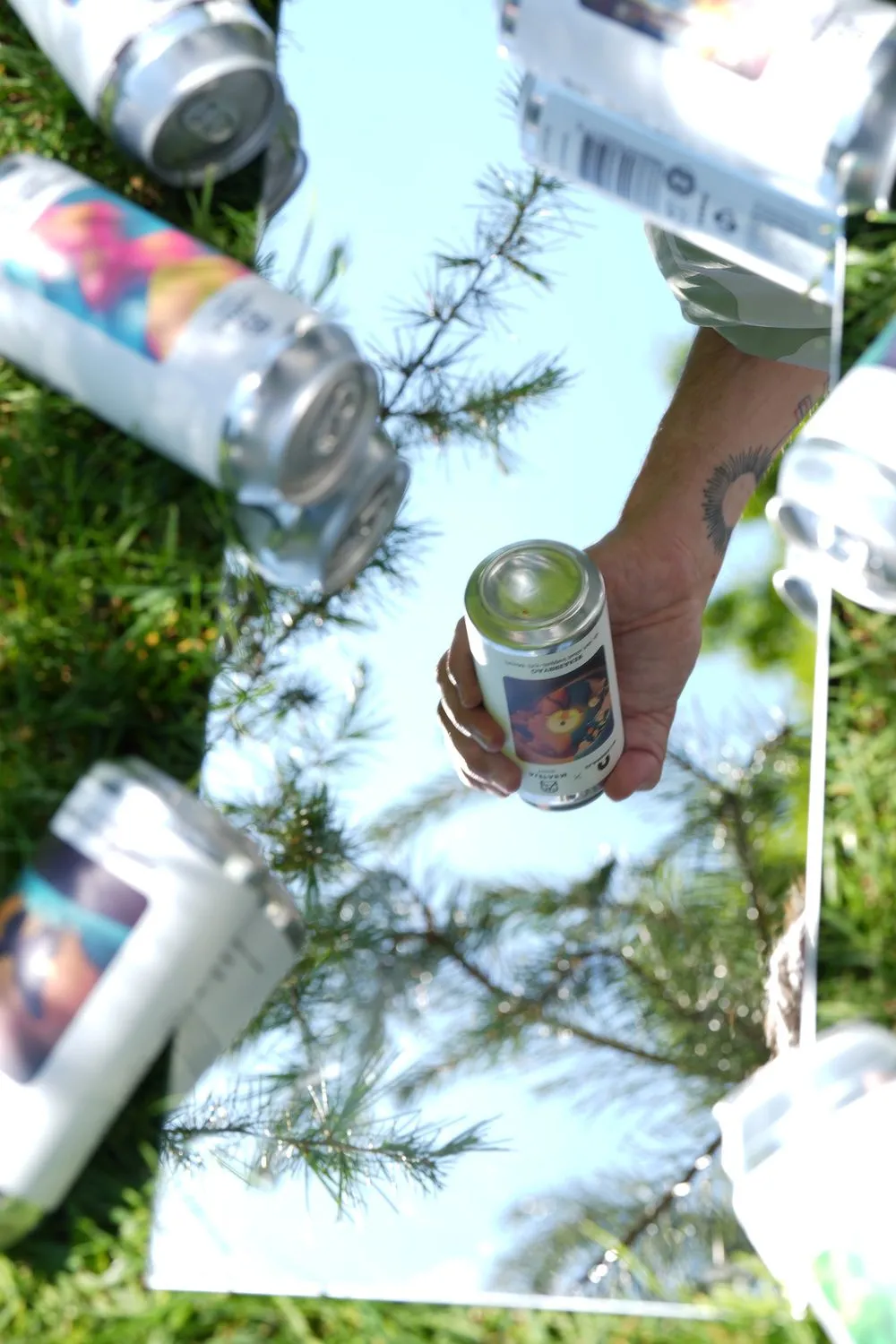 A can held up against the sky