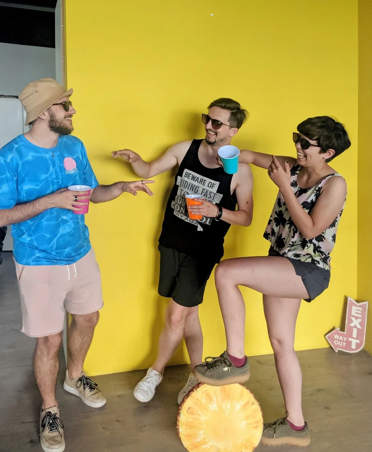 Joking around by the yellow wall