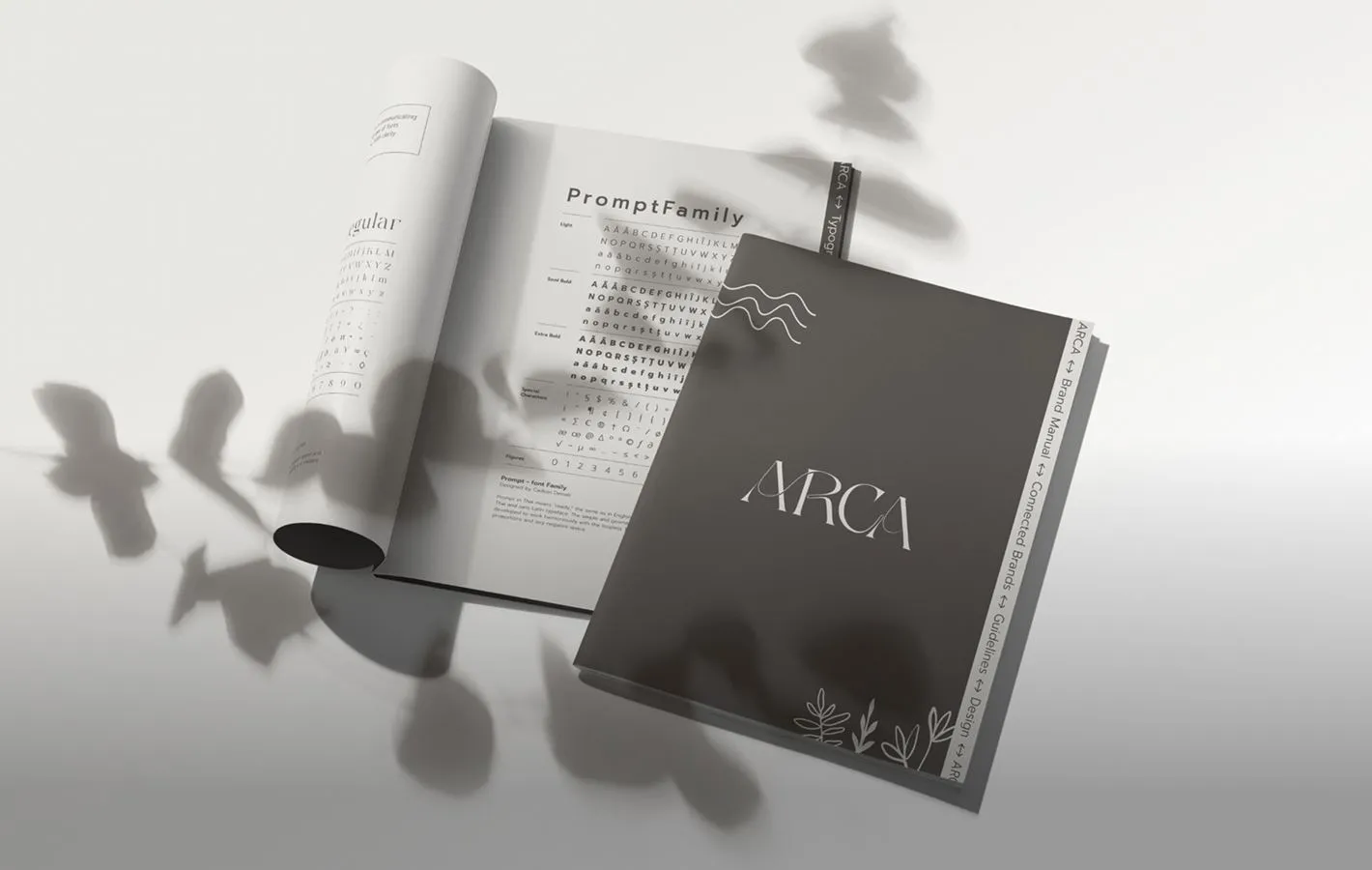 Brand book-ul ARCA deschis pe o masă