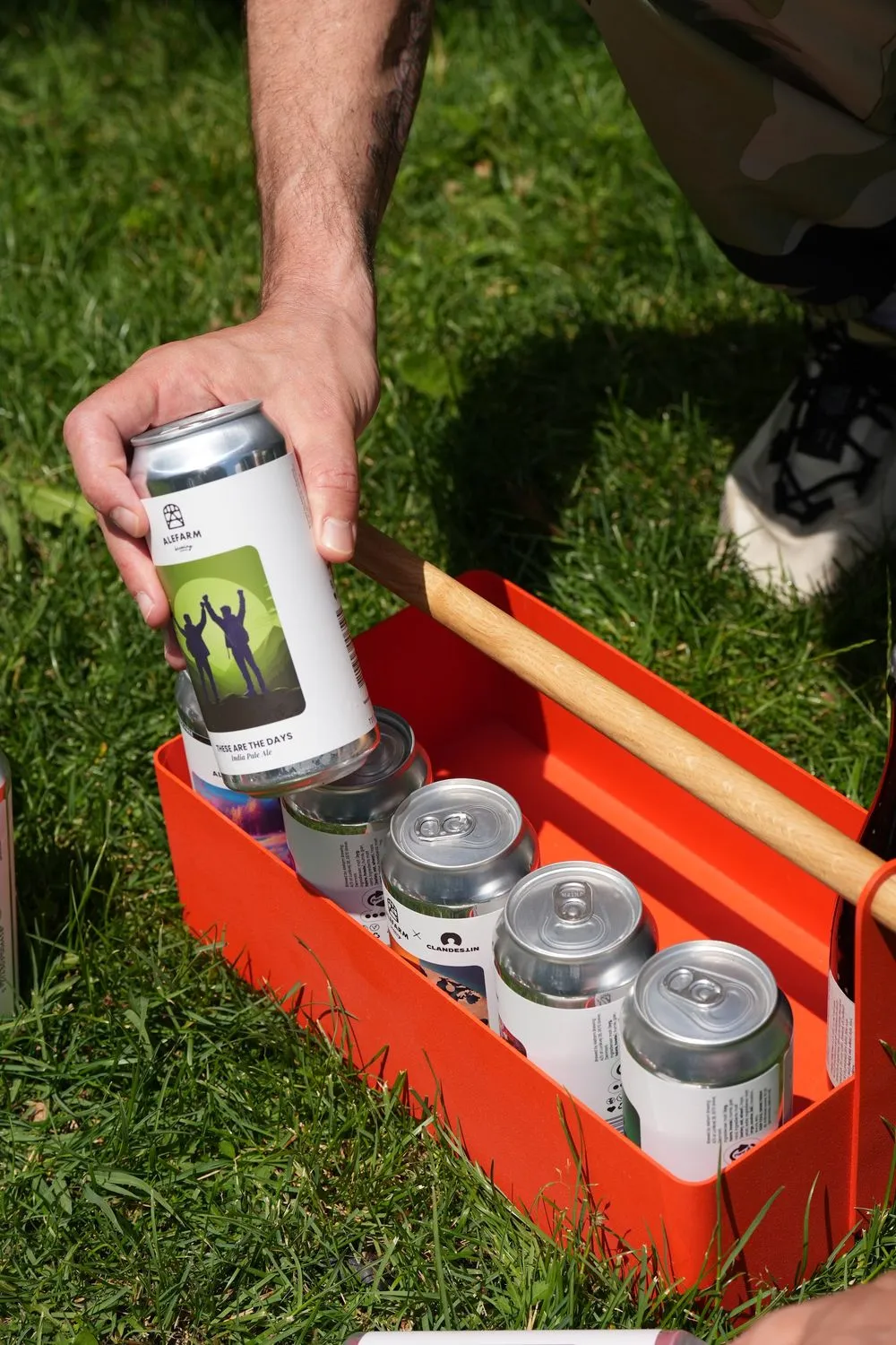 Cans in a red wooden crate